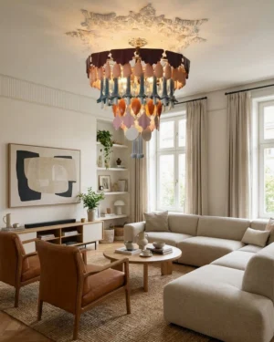 Tintora multi-color statement chandelier installed in modern neutral living room with warm ambient lighting and layered colored ceramic pendants