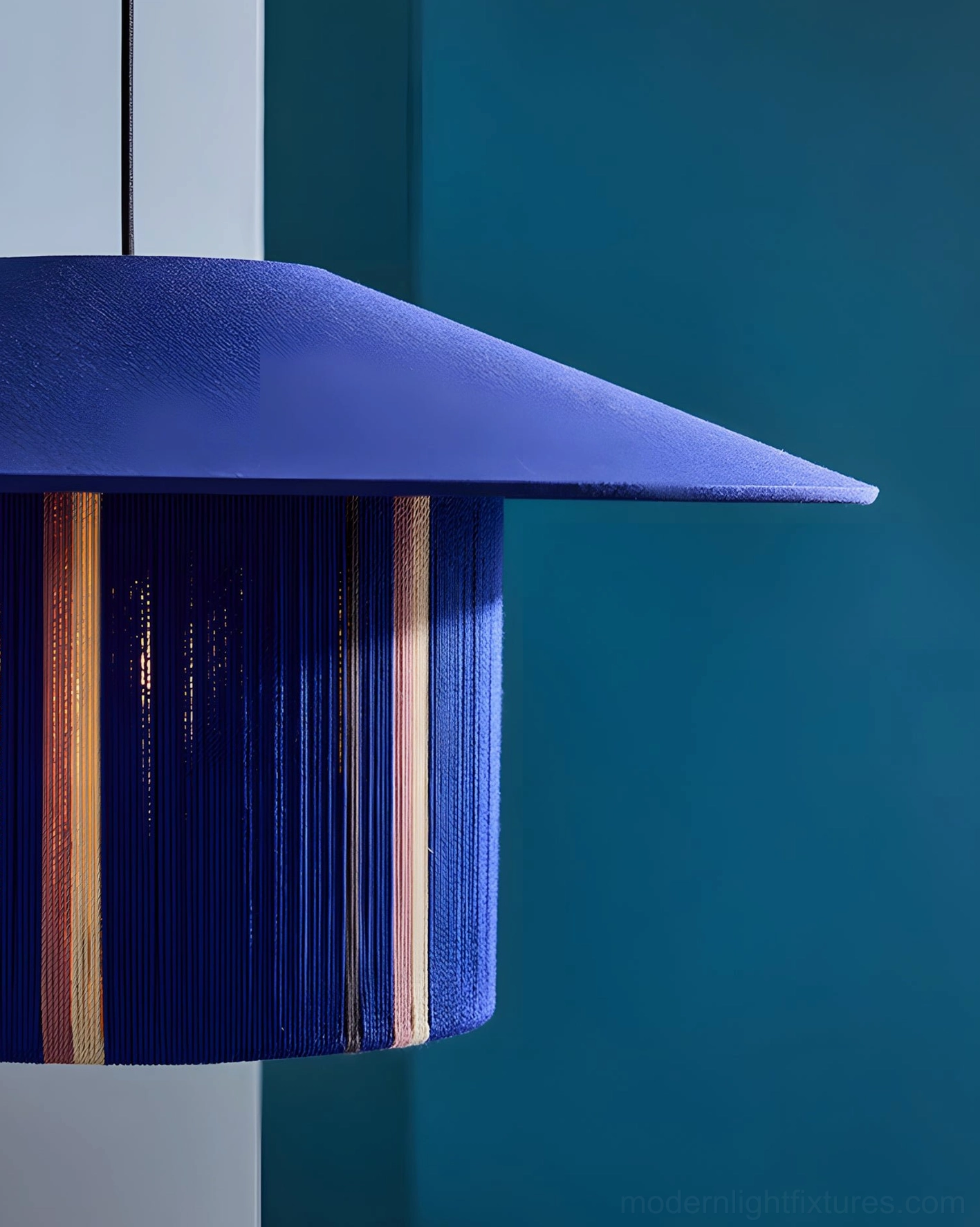 Tivaro blue striped rope pendant lamp detail shot, sculptural form, copper stripe detailing, rope braiding texture