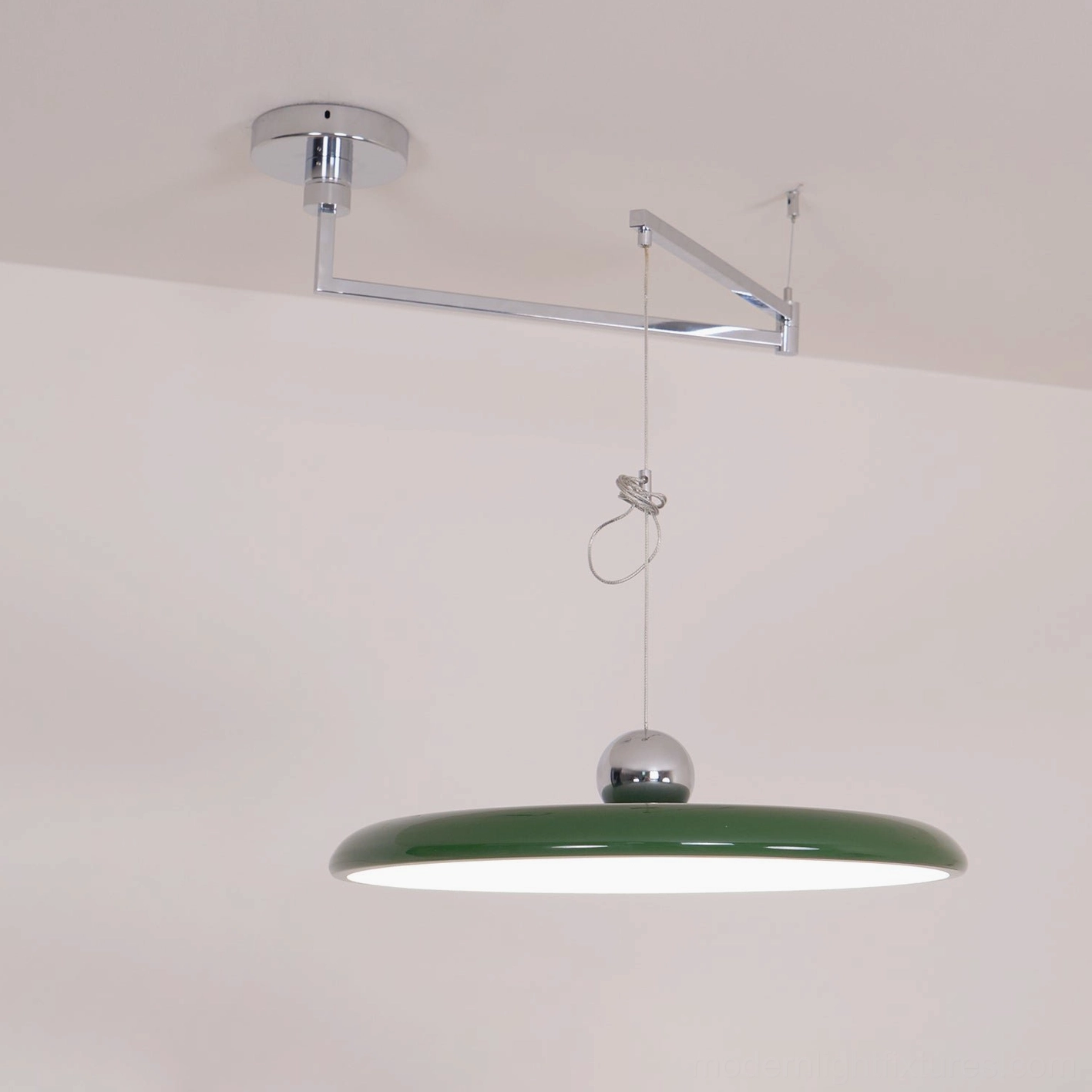 Modern disc pendant lamp showing hardware compatibility with standard electrical boxes