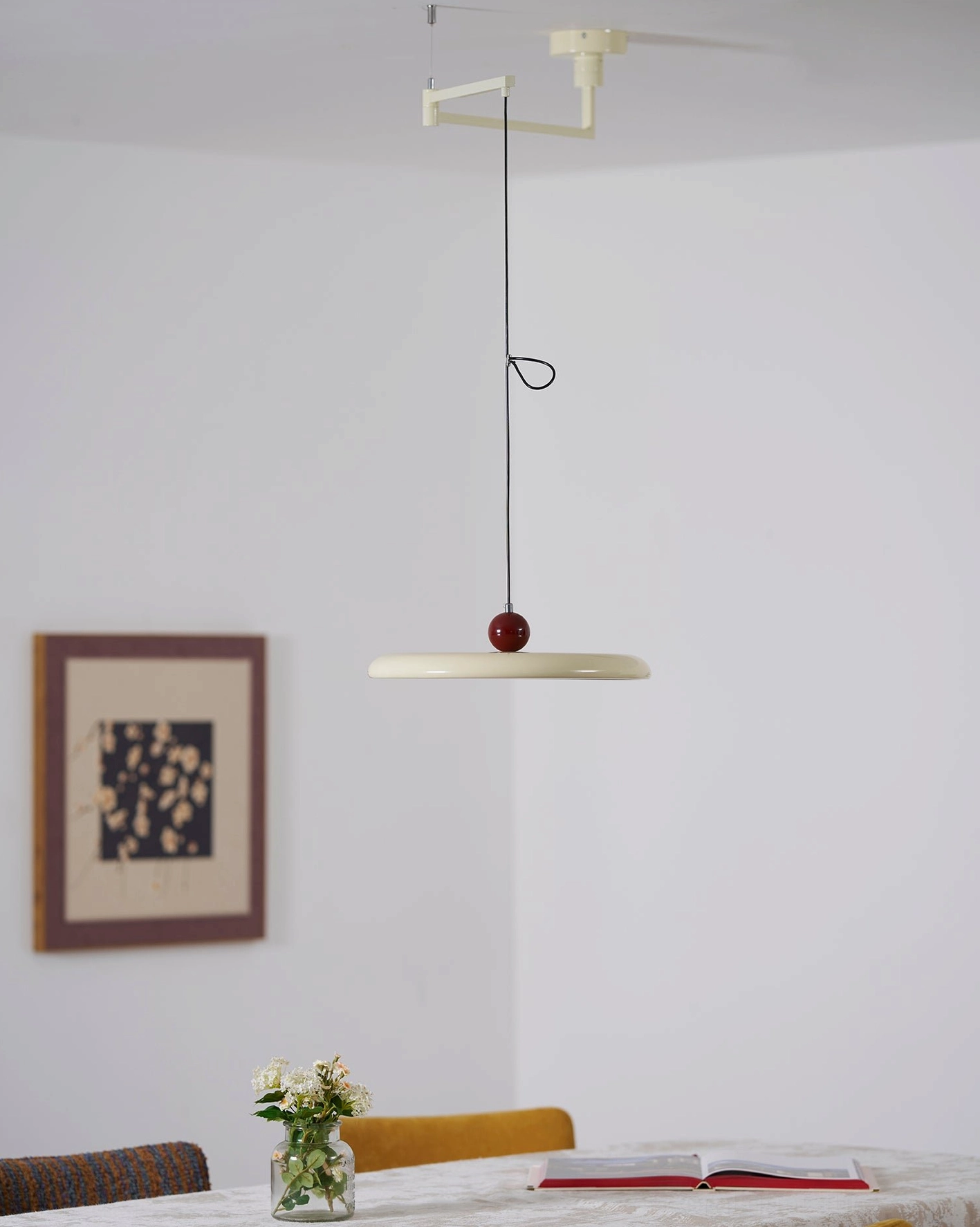 Green and white Tizio pendant lamp variants displayed in modern showroom setting