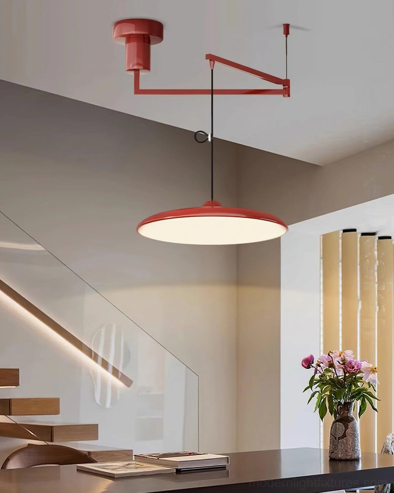 Tizio disc pendant light installed above kitchen island for task and ambient lighting