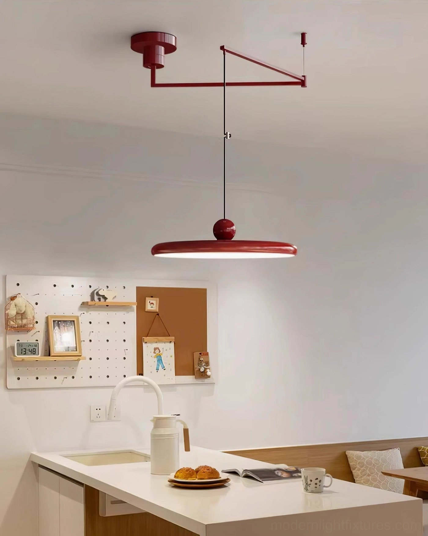Reading nook with 40cm Tizio pendant lamp providing focused ambient light for books