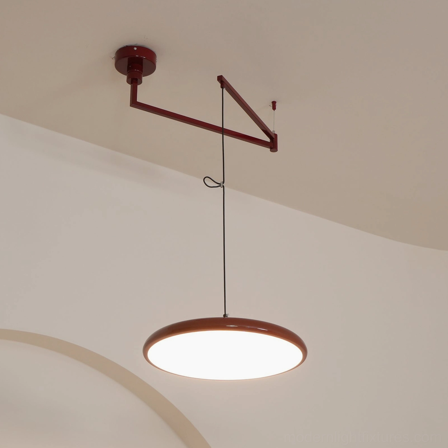 Size comparison between 40cm and 50cm Tizio disc pendant lamps in adjacent spaces
