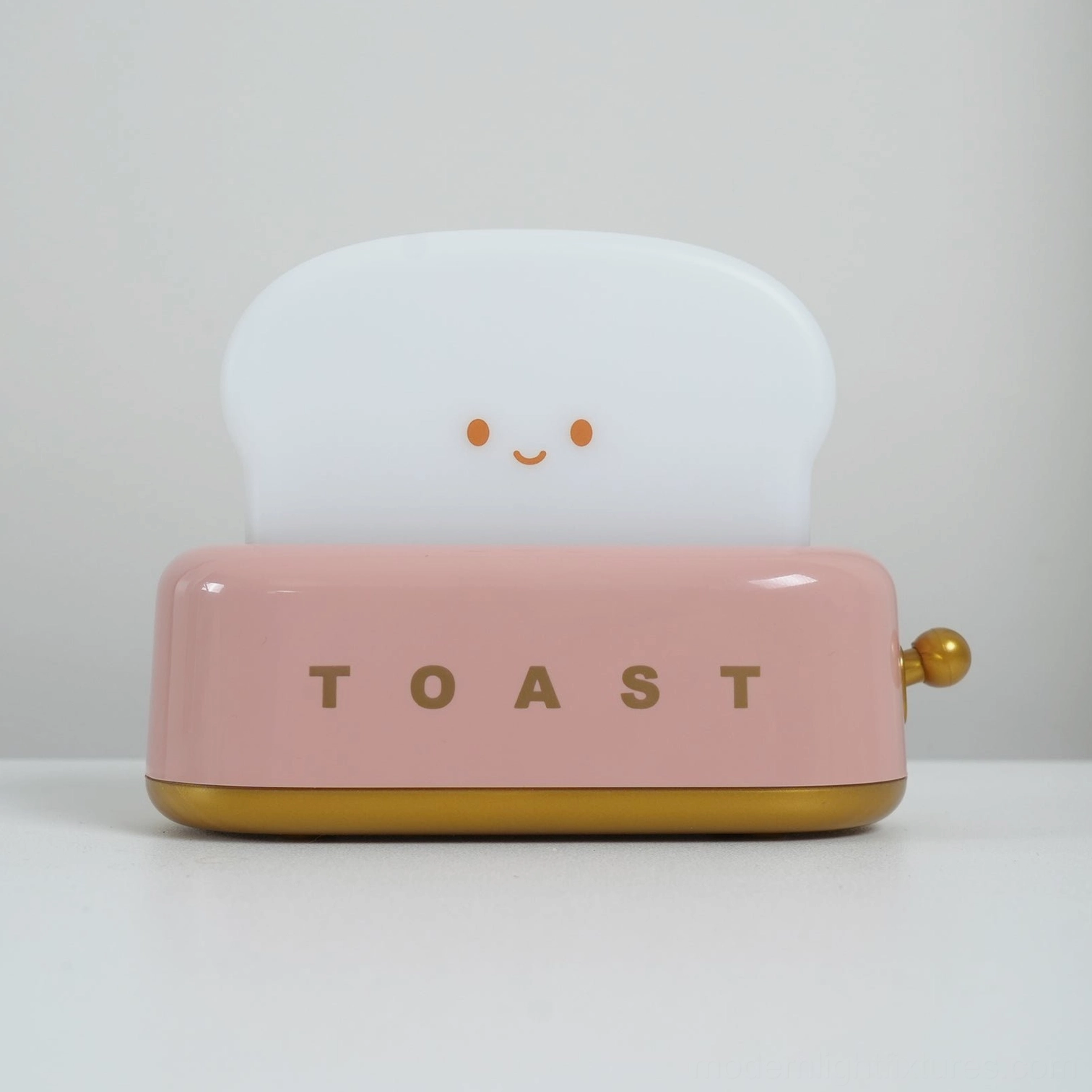 Toaster table lamp with 50,000 hour LED lifespan shown in cozy home environment