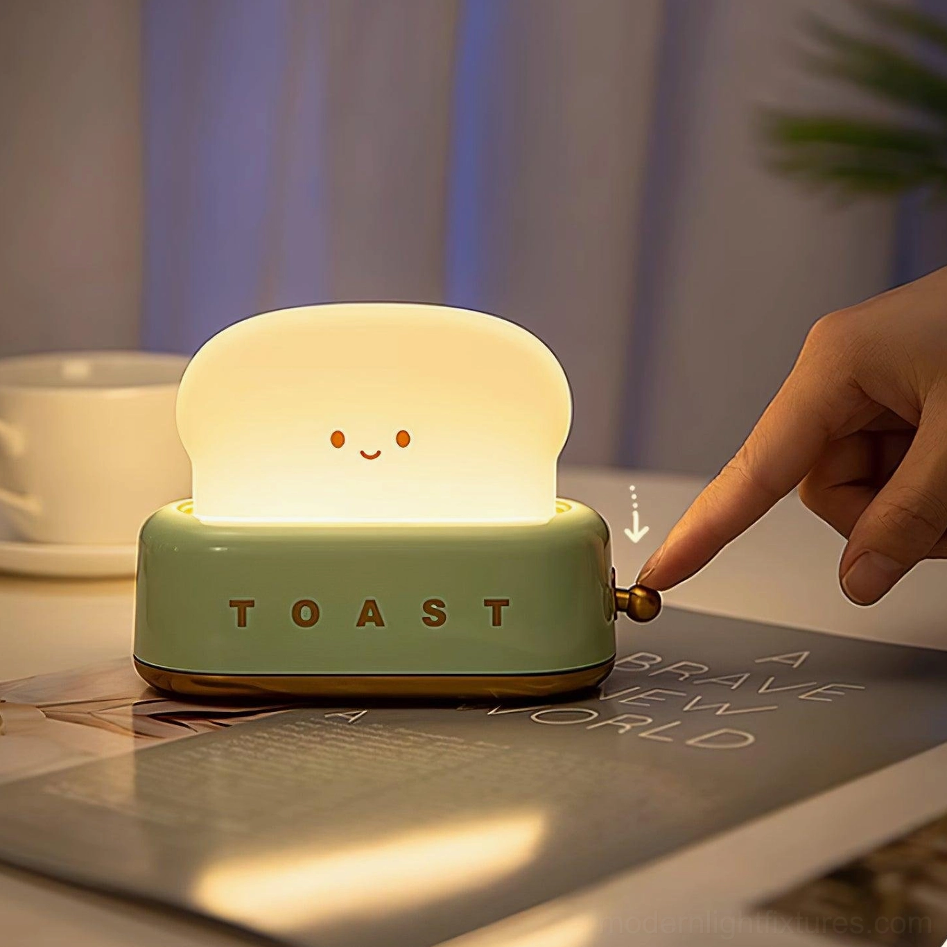 Retro toaster table lamp three-quarter view showing brass power knob adjustment on home office desk