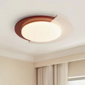 Toina red and white flush mount ceiling light installed on crown molding in modern bedroom