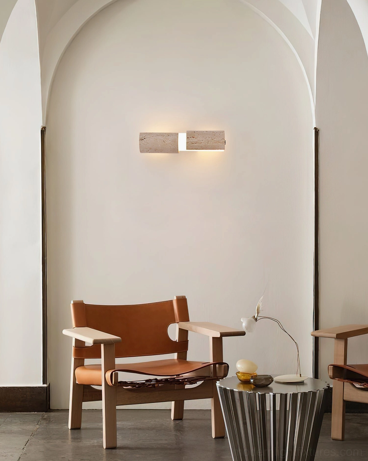 Tolira tall travertine sconce in contemporary home interior, segmented cylindrical design creating visual rhythm
