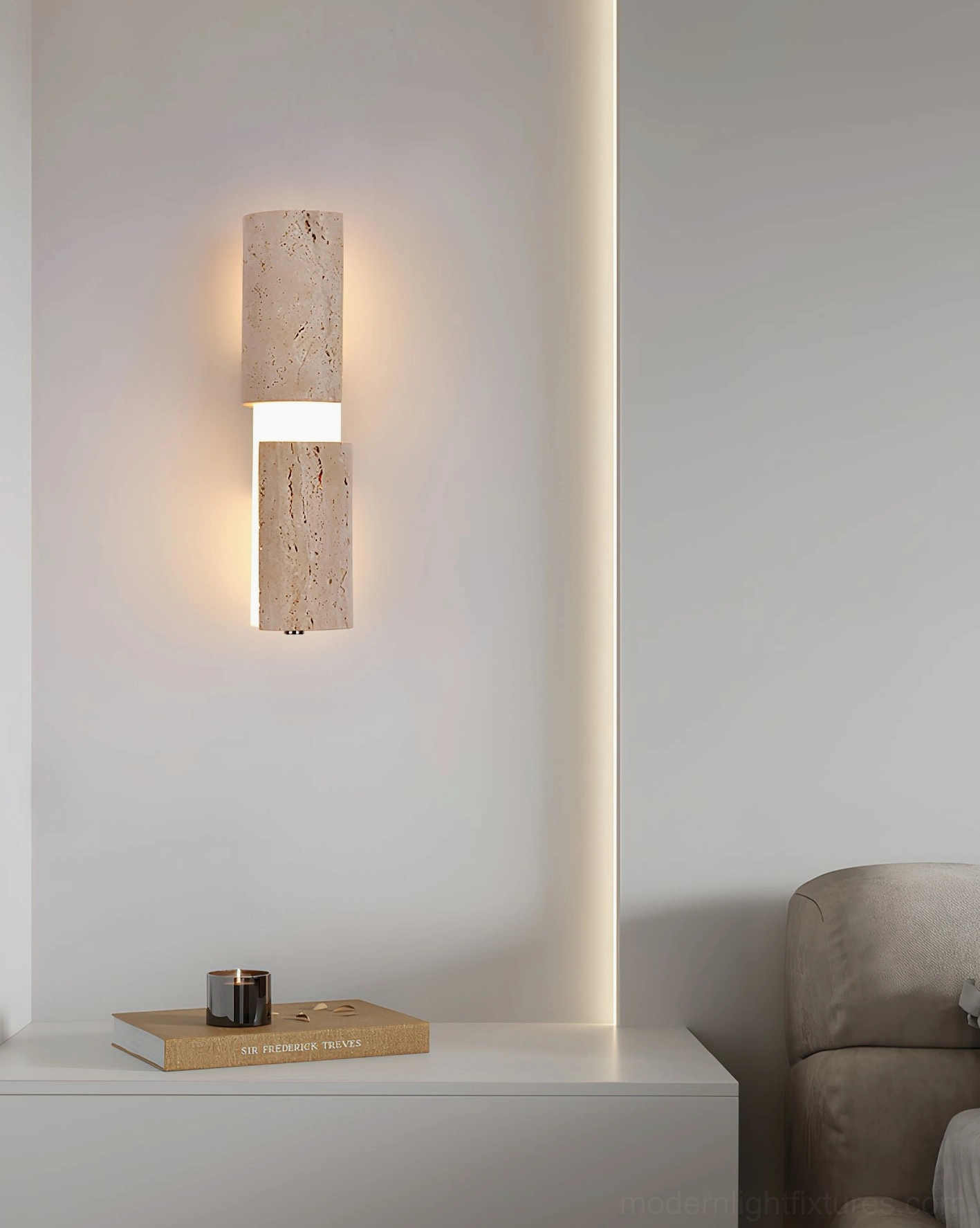 Tolira travertine sconce in bathroom vanity corner, dual-direction warm backlight creating soft atmospheric illumination