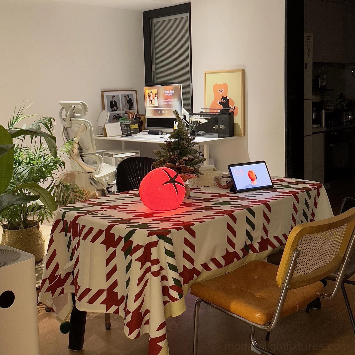 Tomato resin table lamp festive styling on dining table with Christmas patterned tablecloth