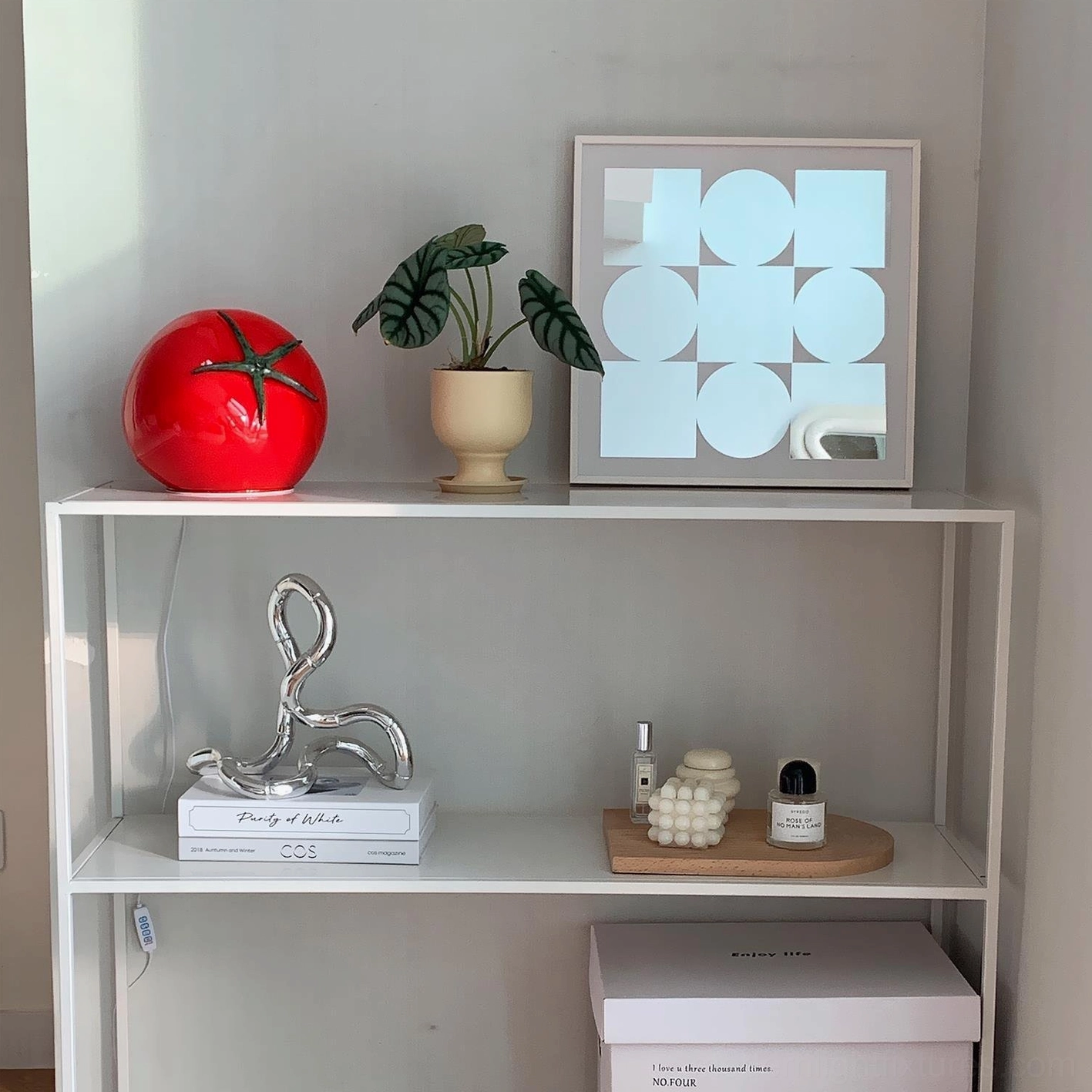 Tomato table lamp contemporary display on living room open shelf with potted plant and geometric art frame