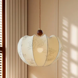 Tonio pendant light in residential interior with warm natural light, three-quarter angle showing twisted cord and fabric details