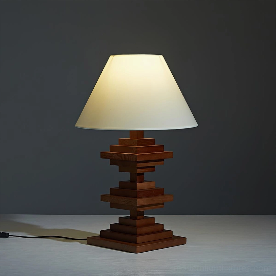 Geometric wooden tower table lamp detail view highlighting sculptural stacked wood base and premium craftsmanship
