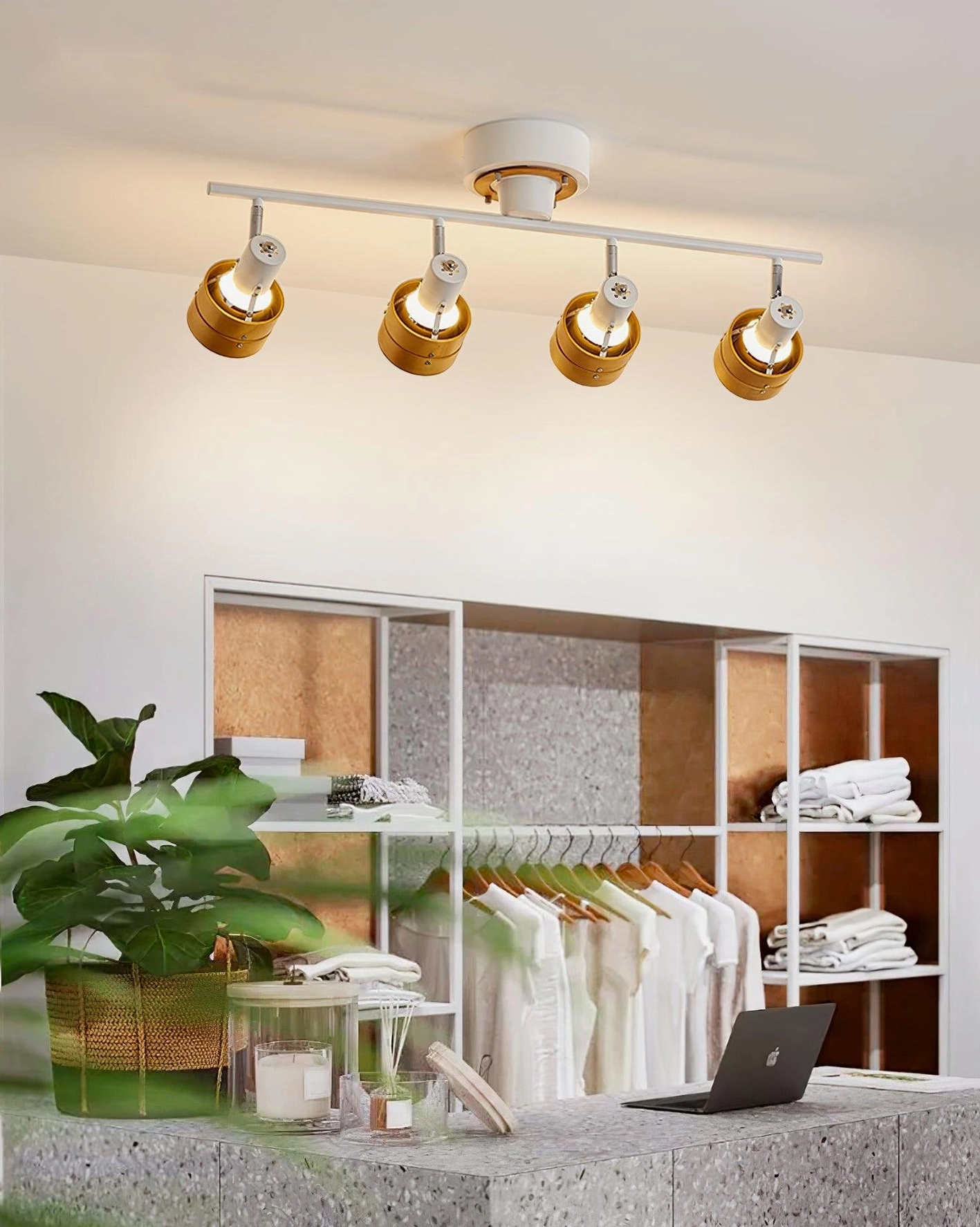 Japanese-inspired ceiling track lighting installed in walk-in closet with white metal and warm gold tones