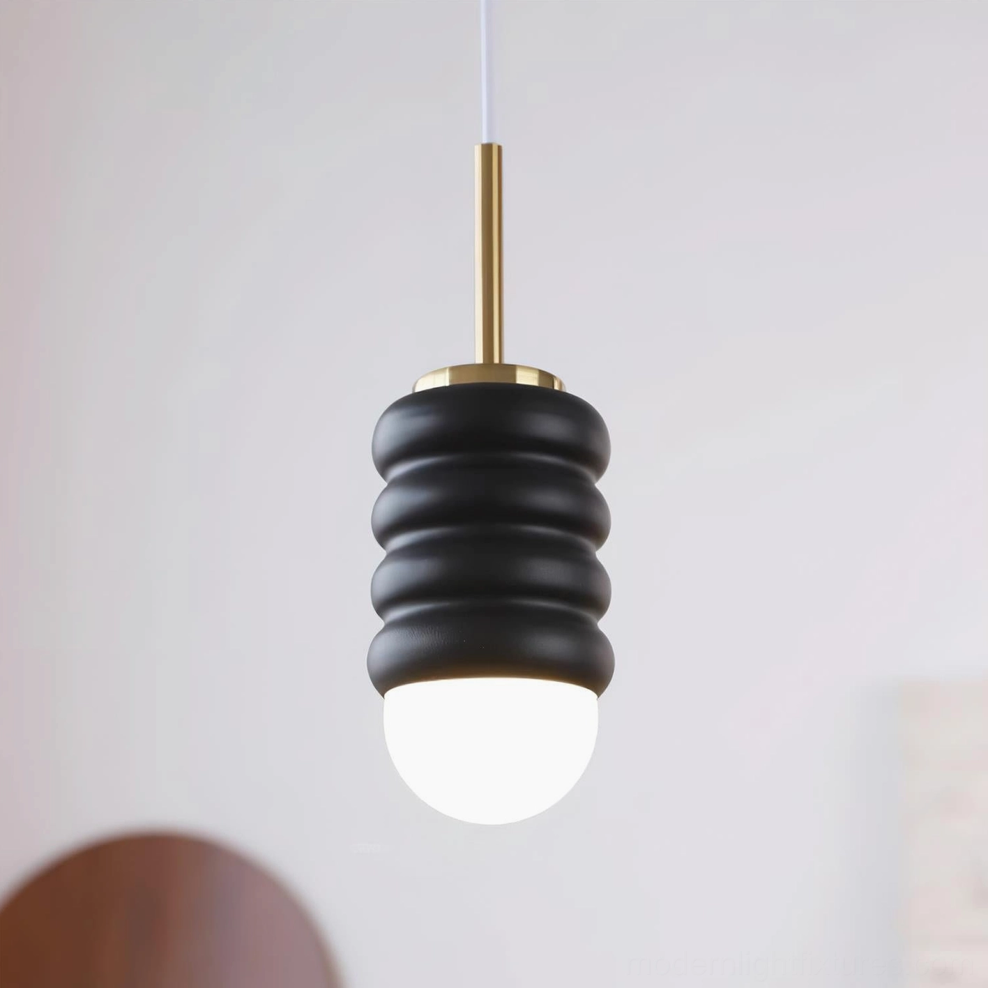 Tranquil pendant light fixture with ripple wave design concept, serene ambiance for living spaces