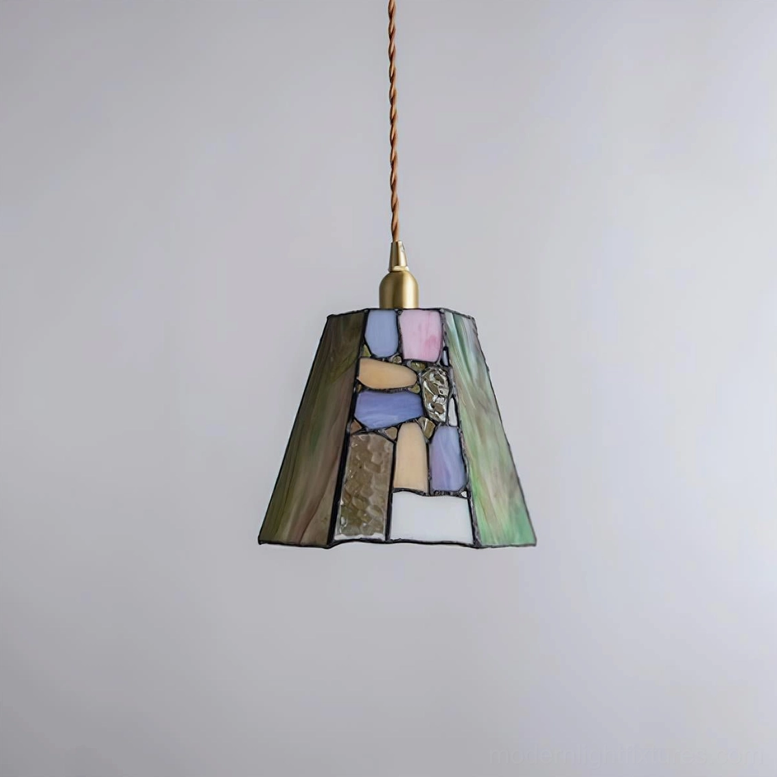 Handcrafted glass pendant fixture in transitional design style, blending traditional and contemporary aesthetics