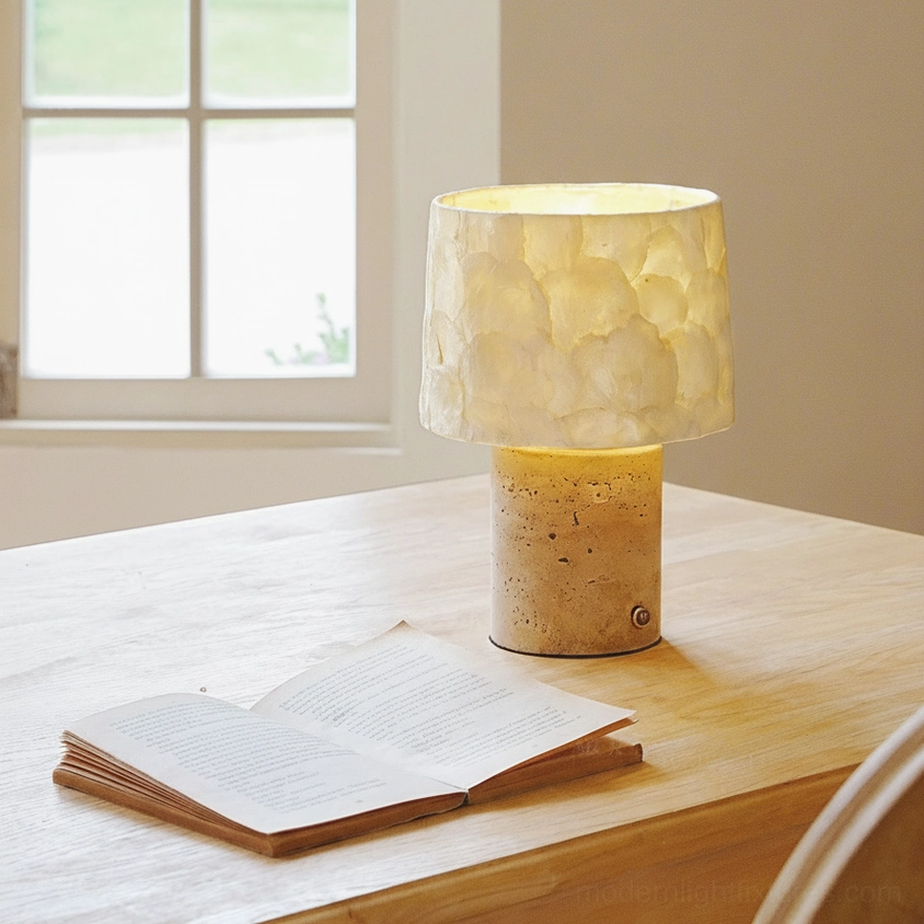 Beige travertine table lamp with natural pitted stone texture detail photography