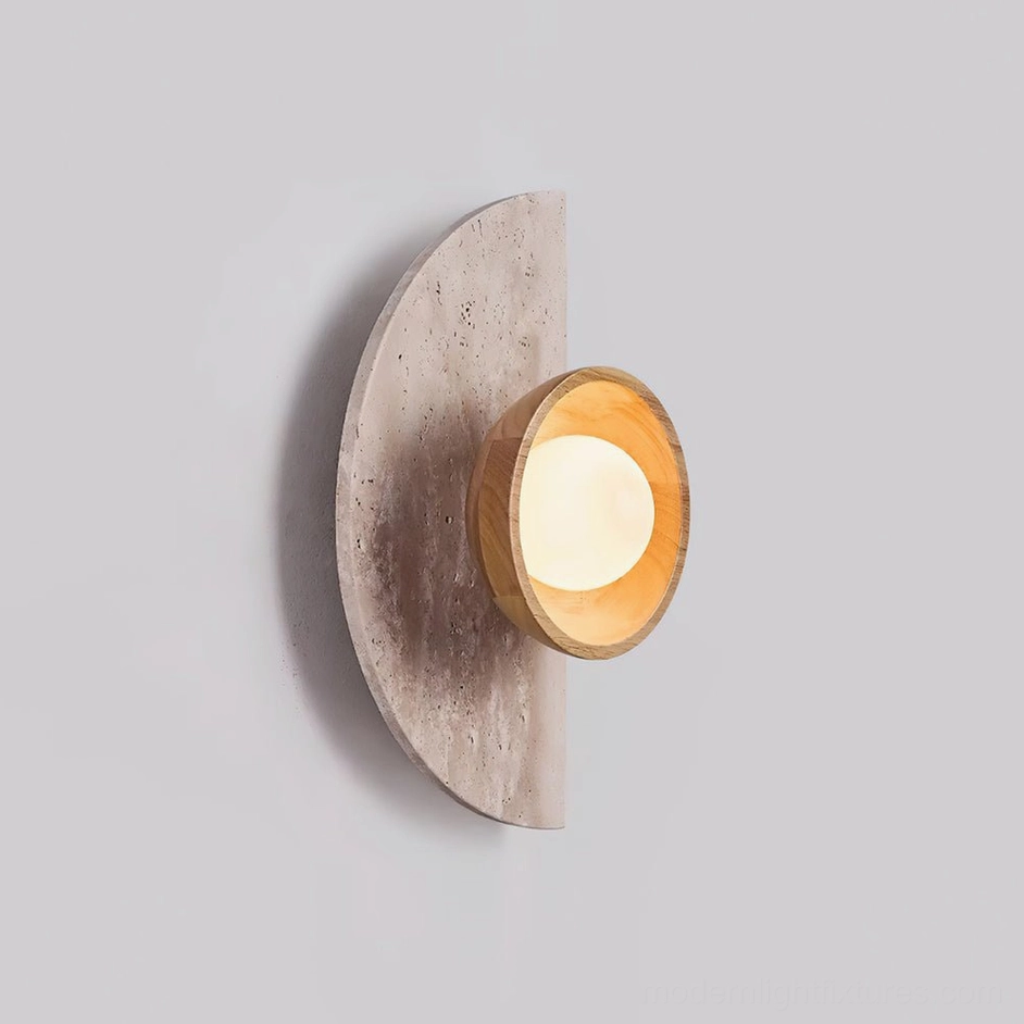Travertine stone wall lamp with beige and natural wood finish in contemporary minimalist bedroom setting