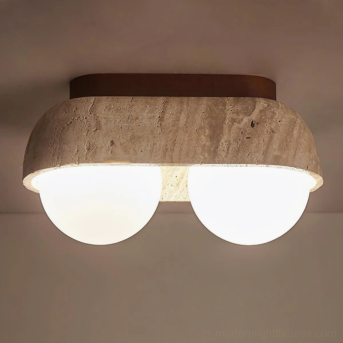 Travertine minimalist ceiling light showing authentic natural stone pitting and frosted glass geometry