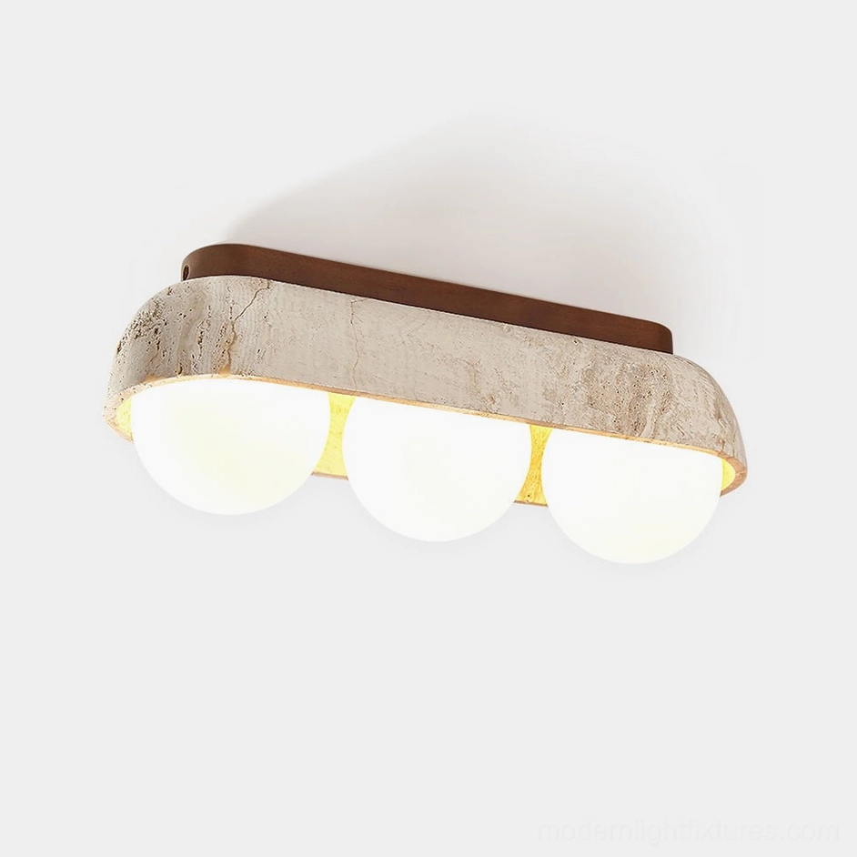3-head travertine minimalist ceiling light fixture with frosted glass globes and dark wood canopy on plain background