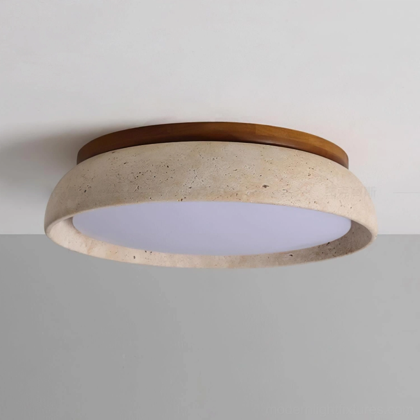 Travertine ceiling light showing integrated LED warm white glow and acrylic diffuser quality