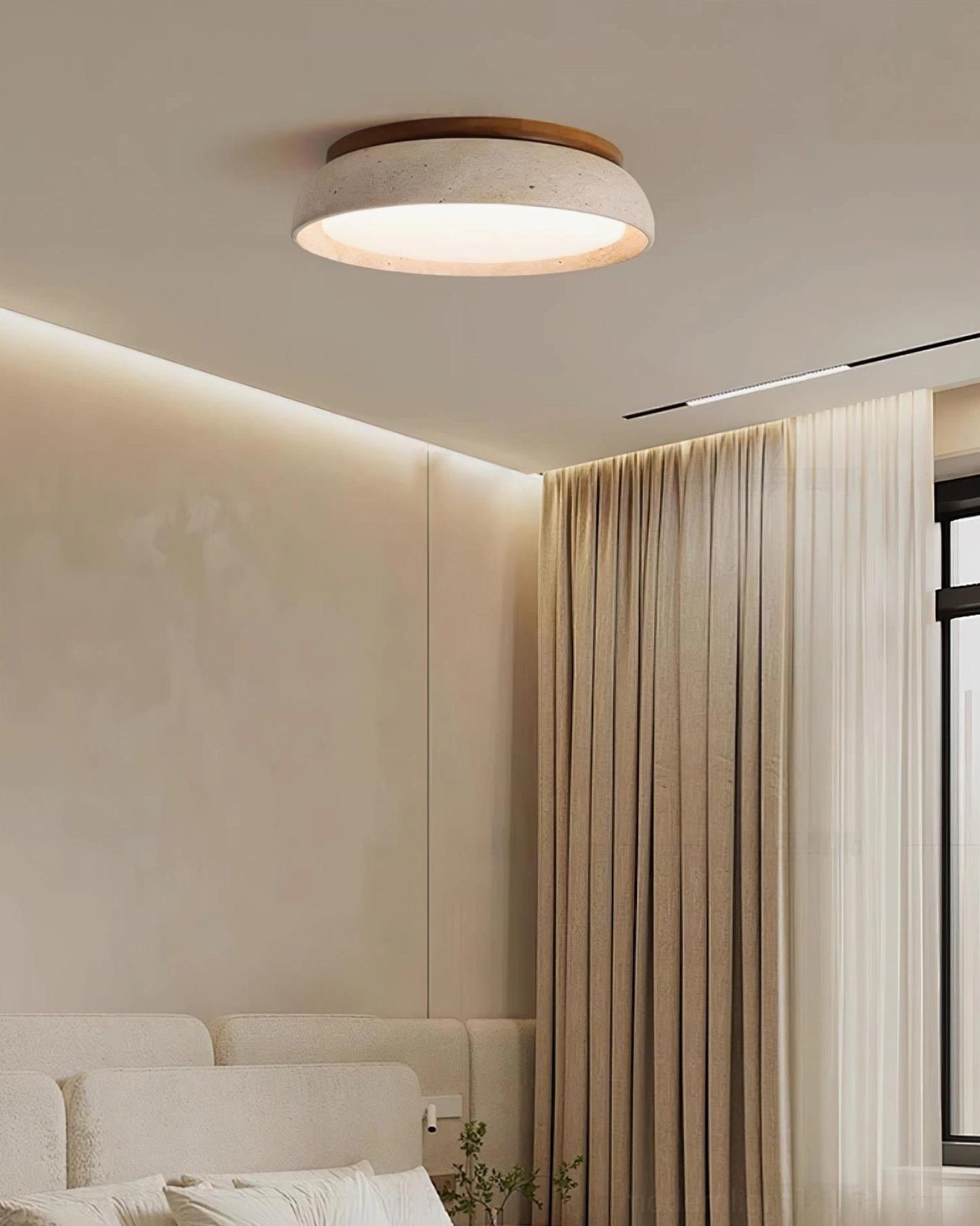 Travertine ceiling light fixture with porous stone texture and warm 3000K color temperature