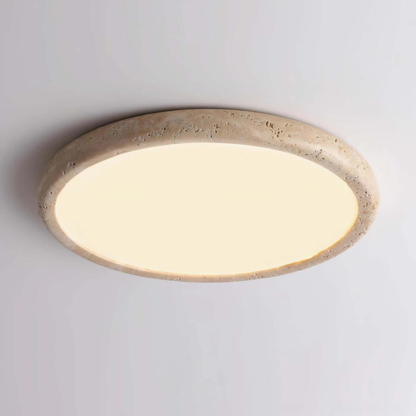 Close-up detail of travertine stone texture on modern ceiling light fixture
