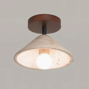 Close-up detail of travertine stone texture and porous surface on Sierra ceiling light fixture