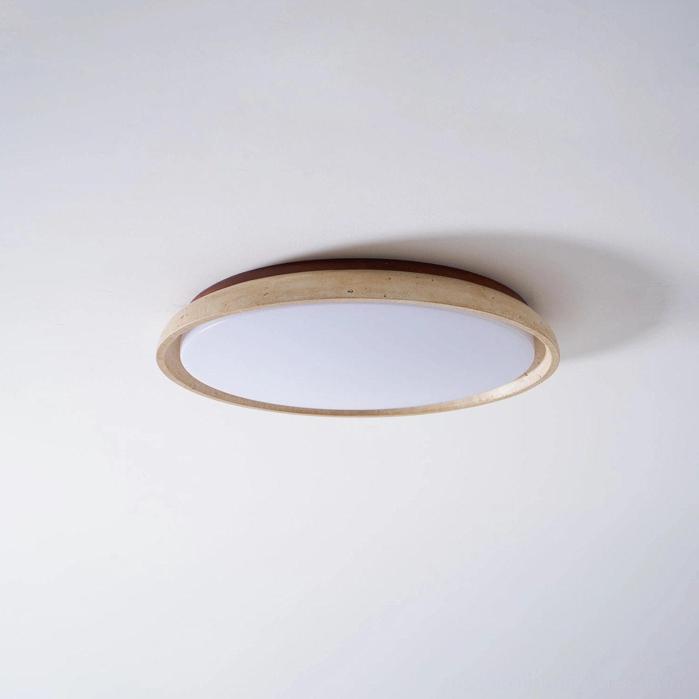 Travertine natural stone ceiling light in upscale interior with walnut wood finish accent