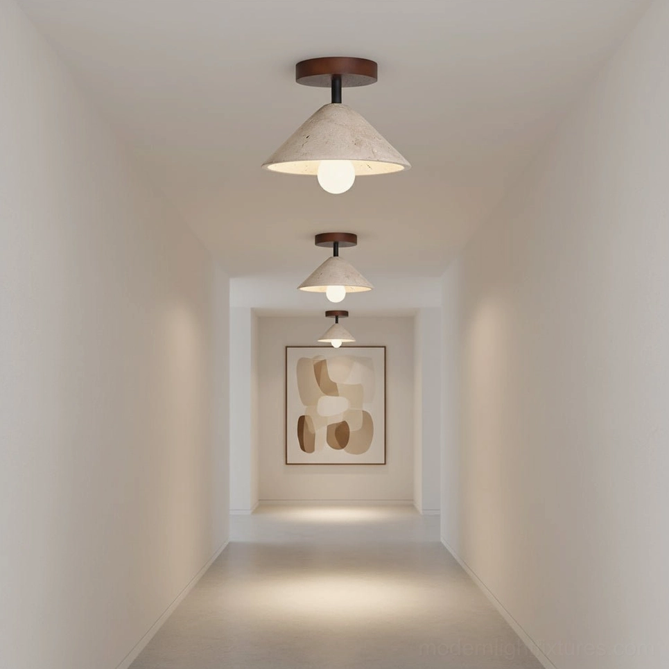 Row of Sierra travertine semi-flush ceiling lights in decorated residential hallway with wall art
