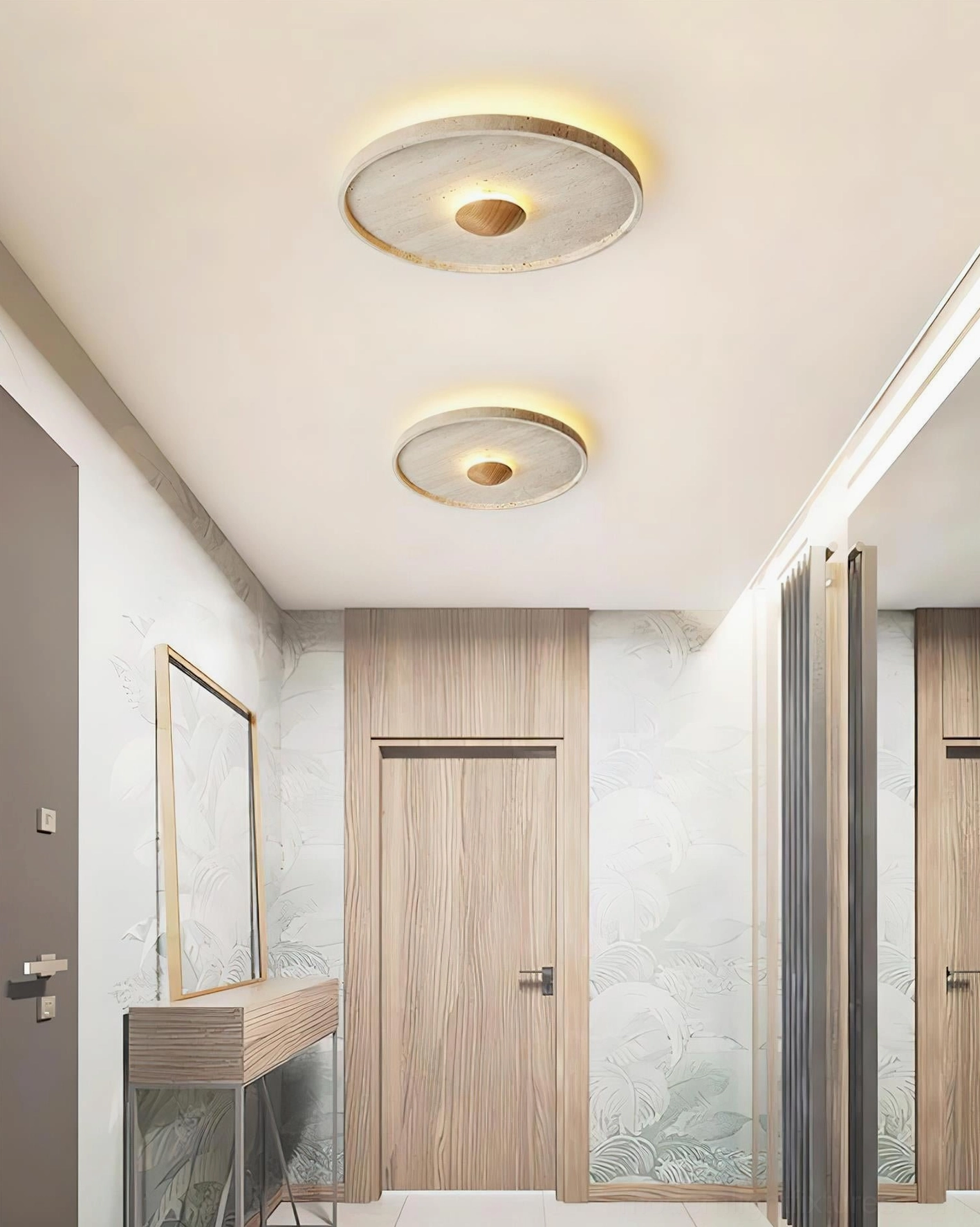 Pair of travertine ceiling lights installed in minimalist hallway entryway