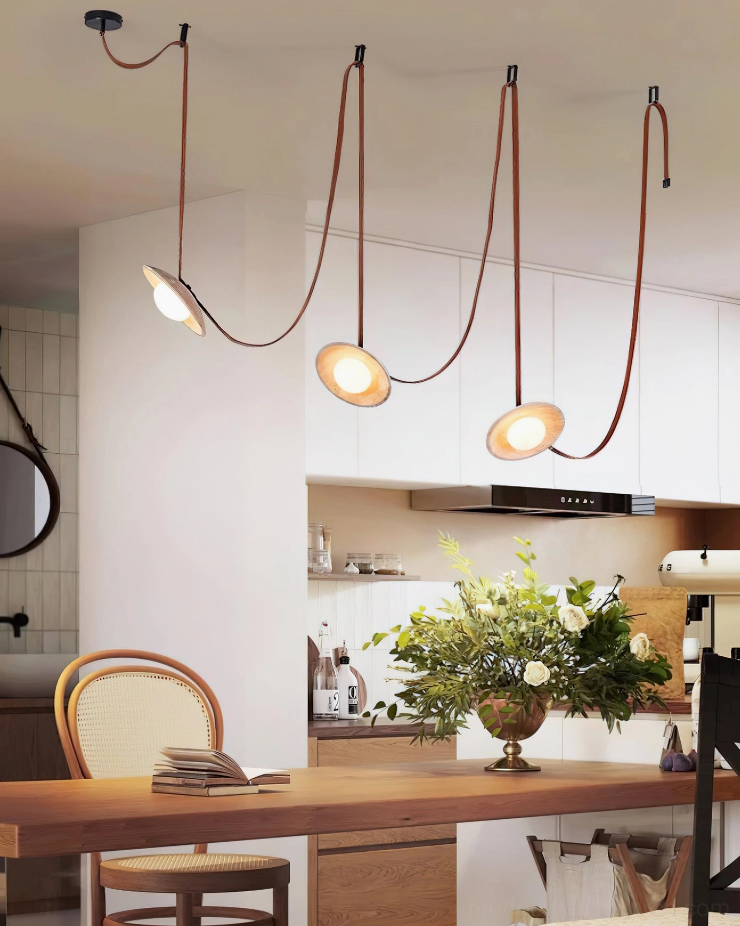 Travertine chandelier close-up detail showing leather strap suspension and disc lamp shade construction