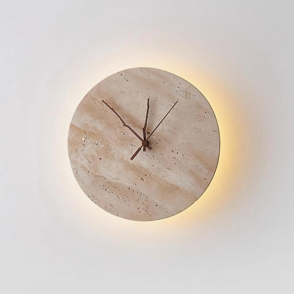 Beige travertine clock wall lamp with warm LED backlighting creating ambient glow effect