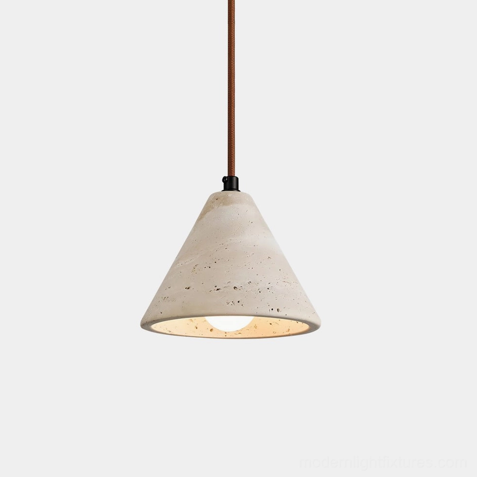 Lit travertine conical pendant light with warm amber glow showcasing porous stone texture and natural variations