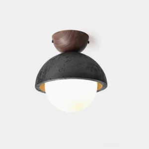 Travertine dome ceiling light with frosted glass diffuser and warm wood detailing, studio front view