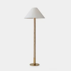 Travertine column floor lamp with tapered fabric shade on white background, showing clean architectural silhouette and warm metal accents