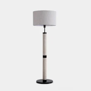Modern travertine column floor lamp with black metal base and beige fabric shade - front studio view