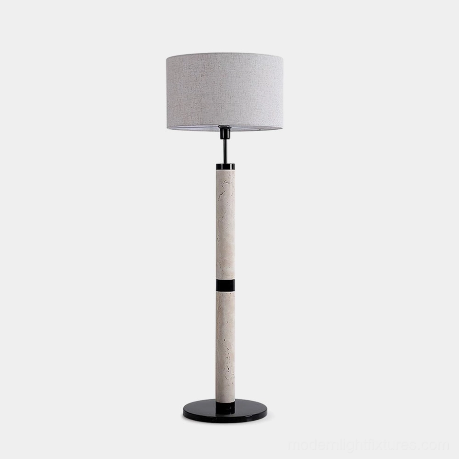 Modern travertine column floor lamp with black metal base and beige fabric shade - front studio view