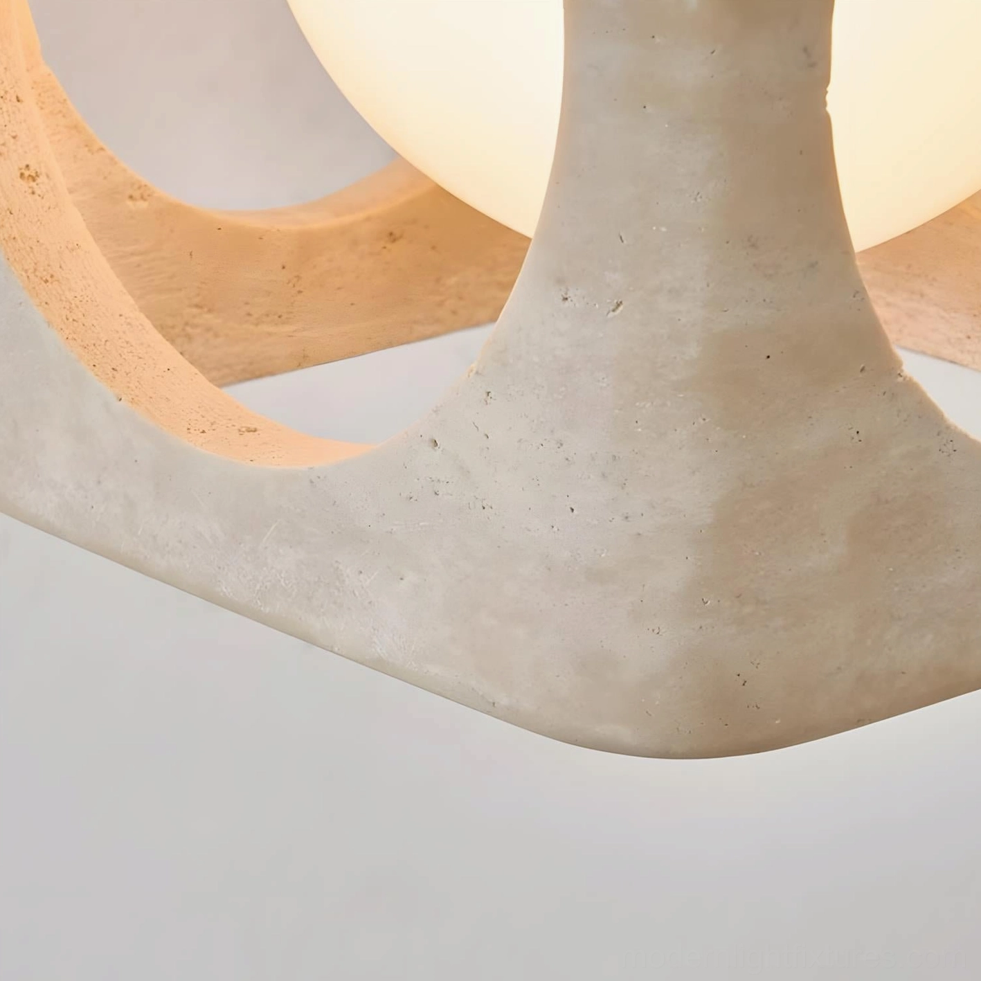 Hollowa travertine geometric pendant light installation showcasing architectural form and minimalist elegance