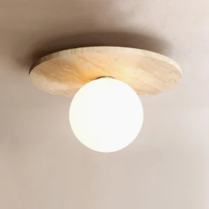 Modern travertine and white glass flush mount ceiling light fixture with warm neutral background highlighting natural stone details