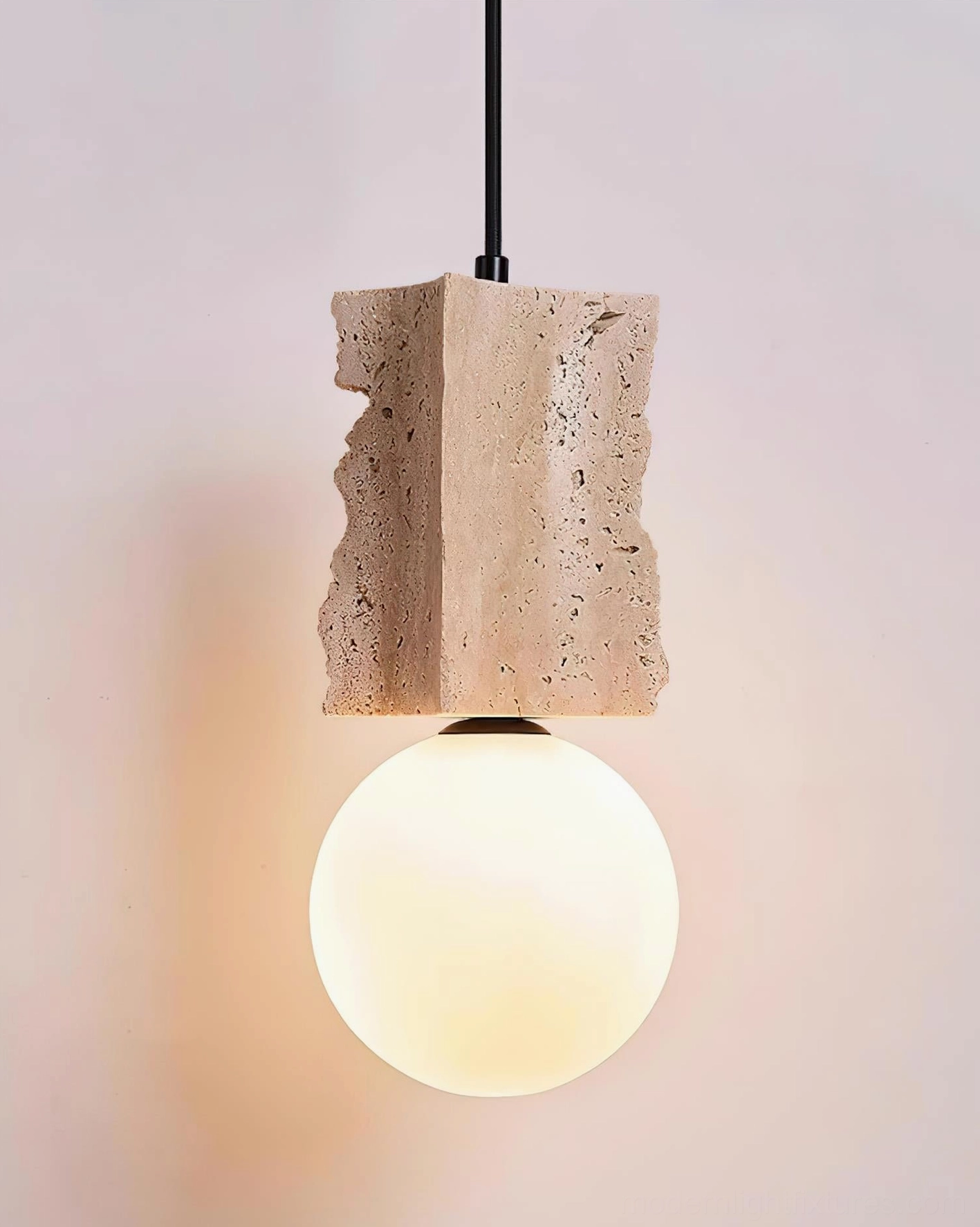 Travertine pendant lamp mounted in contemporary home interior creating focal point accent lighting with natural aesthetic