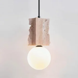 Travertine pendant lamp three-quarter angle showcasing organic stone texture and natural surface irregularities characteristic of authentic travertine