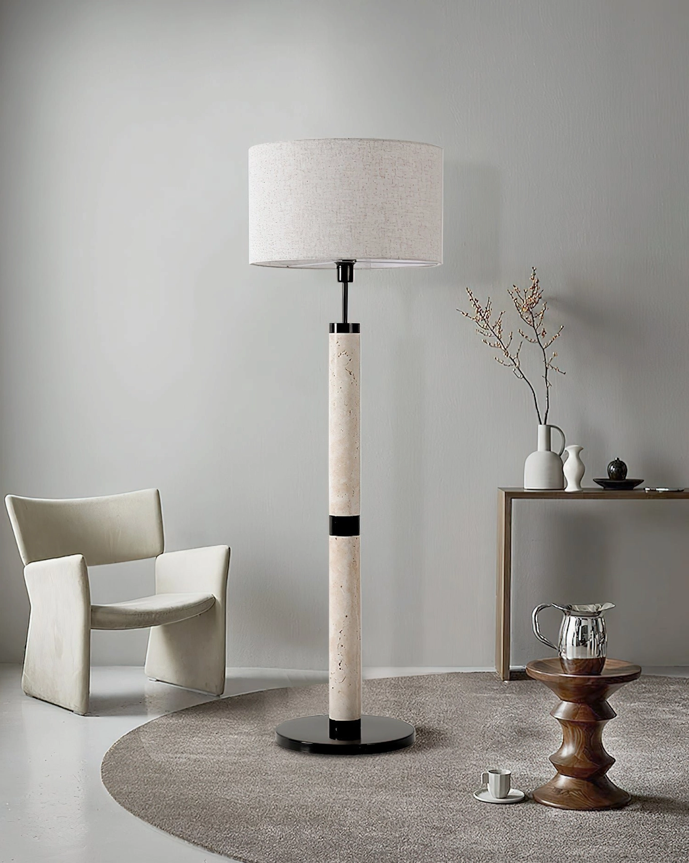 Beige fabric shade travertine floor lamp - warm light diffusion in contemporary interior setting