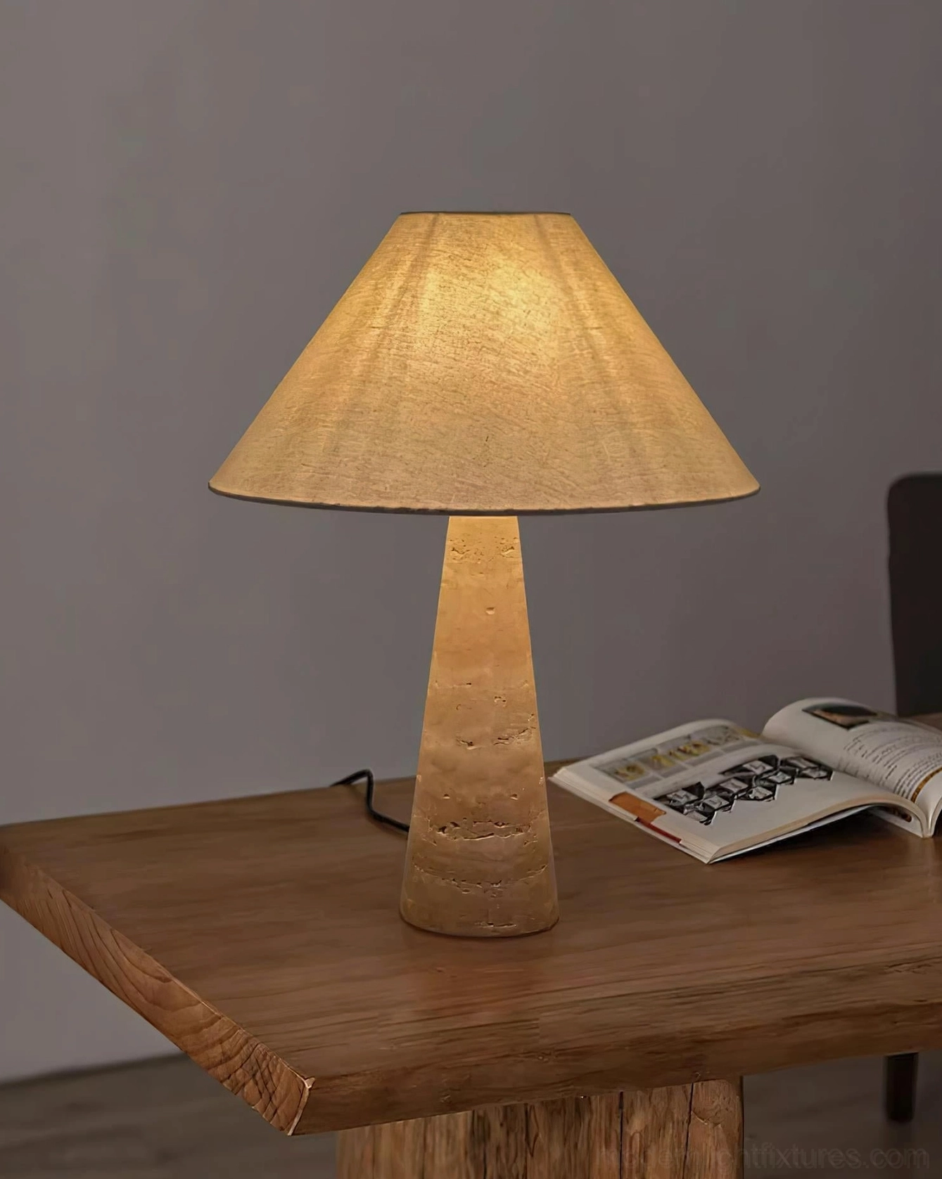 Organic modern travertine lamp celebrating wabi-sabi design philosophy with authentic stone geological beauty