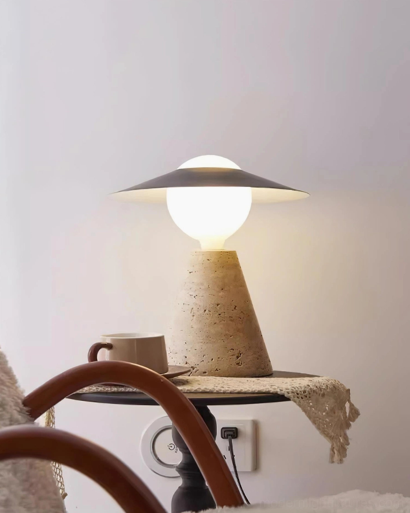 Modern travertine table lamp functioning as sculptural room accent