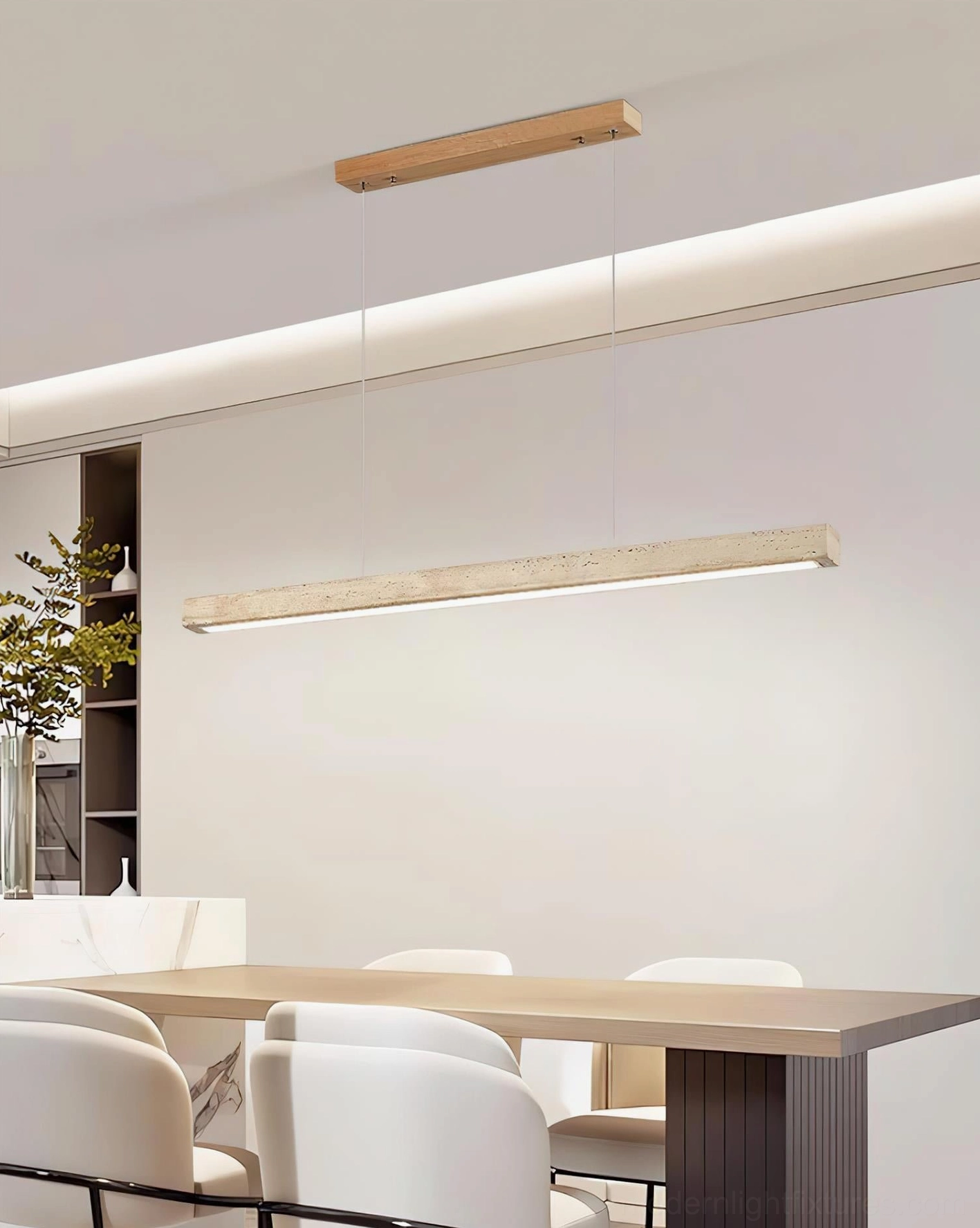 Modern travertine pendant chandelier above wooden dining table warm natural lighting
