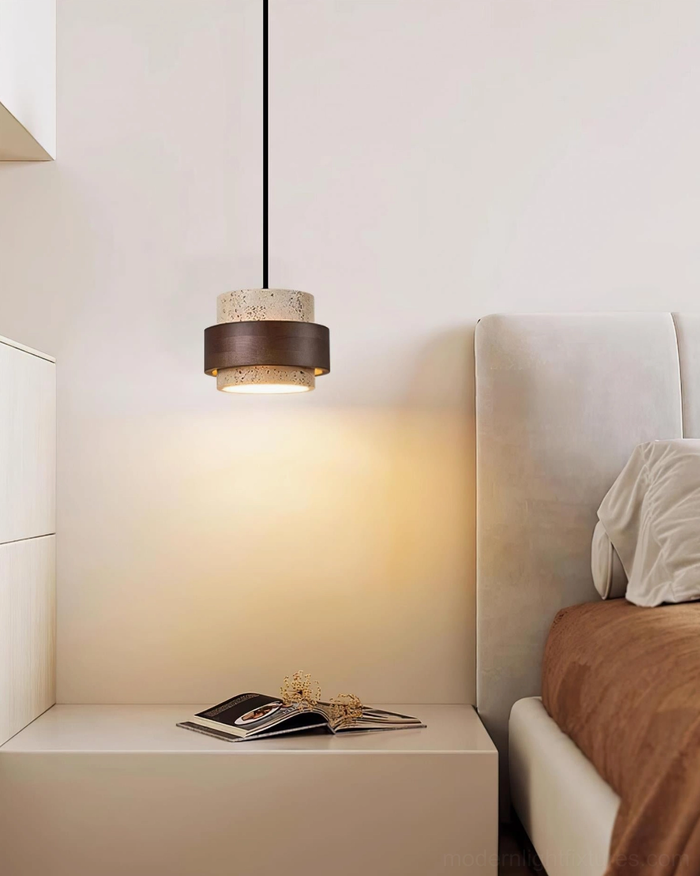 Travertine pendant hanging in minimalist bedroom with warm ambient lighting and neutral furnishings