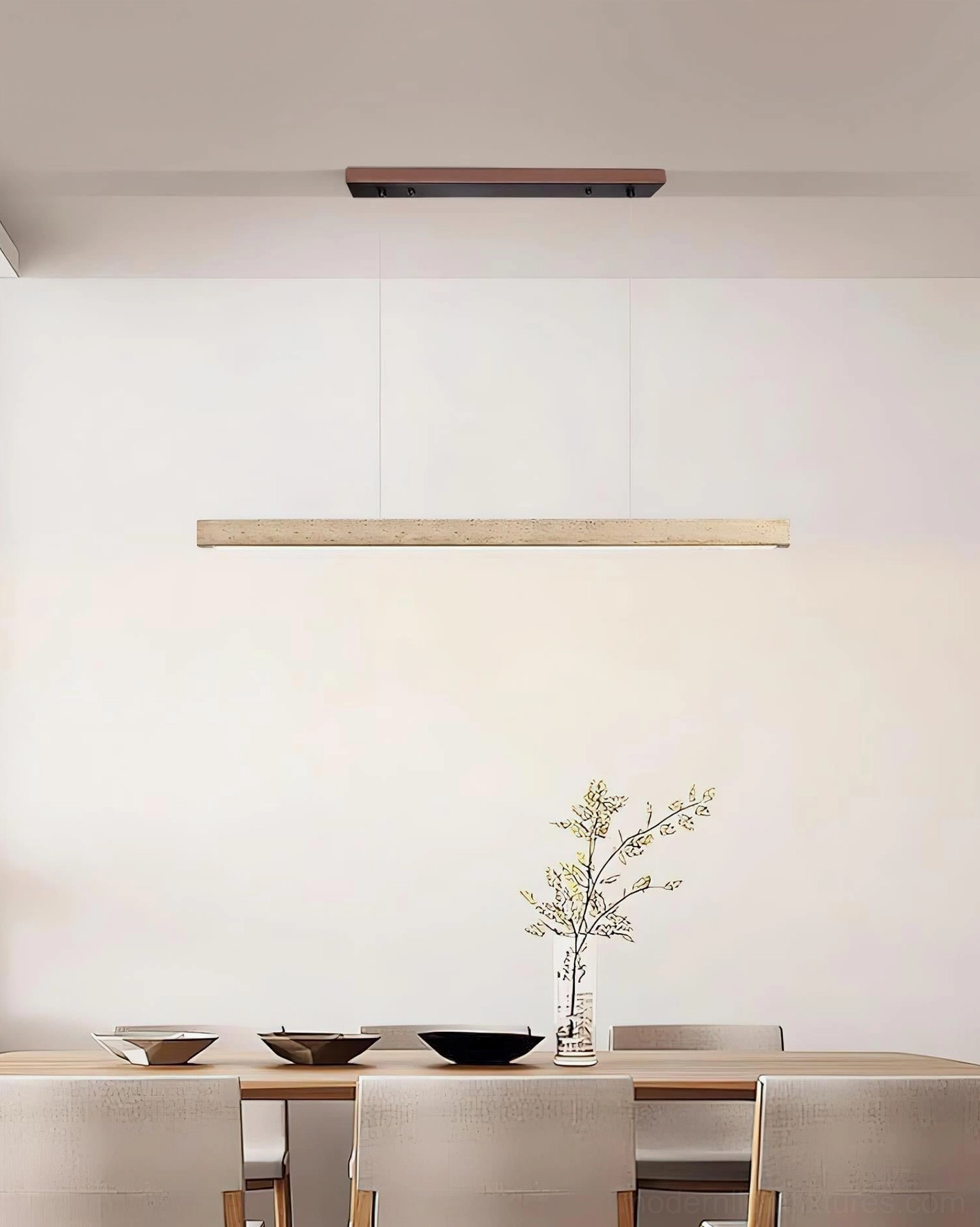 Linear travertine stone pendant chandelier contemporary dining space with tableware