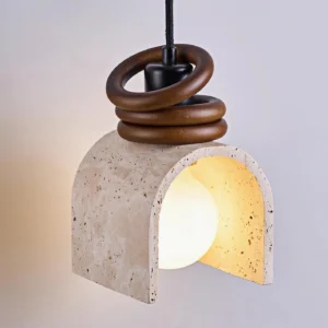 Close-up front view of natural stone pendant lamp highlighting porous travertine texture, double-layer wooden ring accents, and warm interior lighting detail