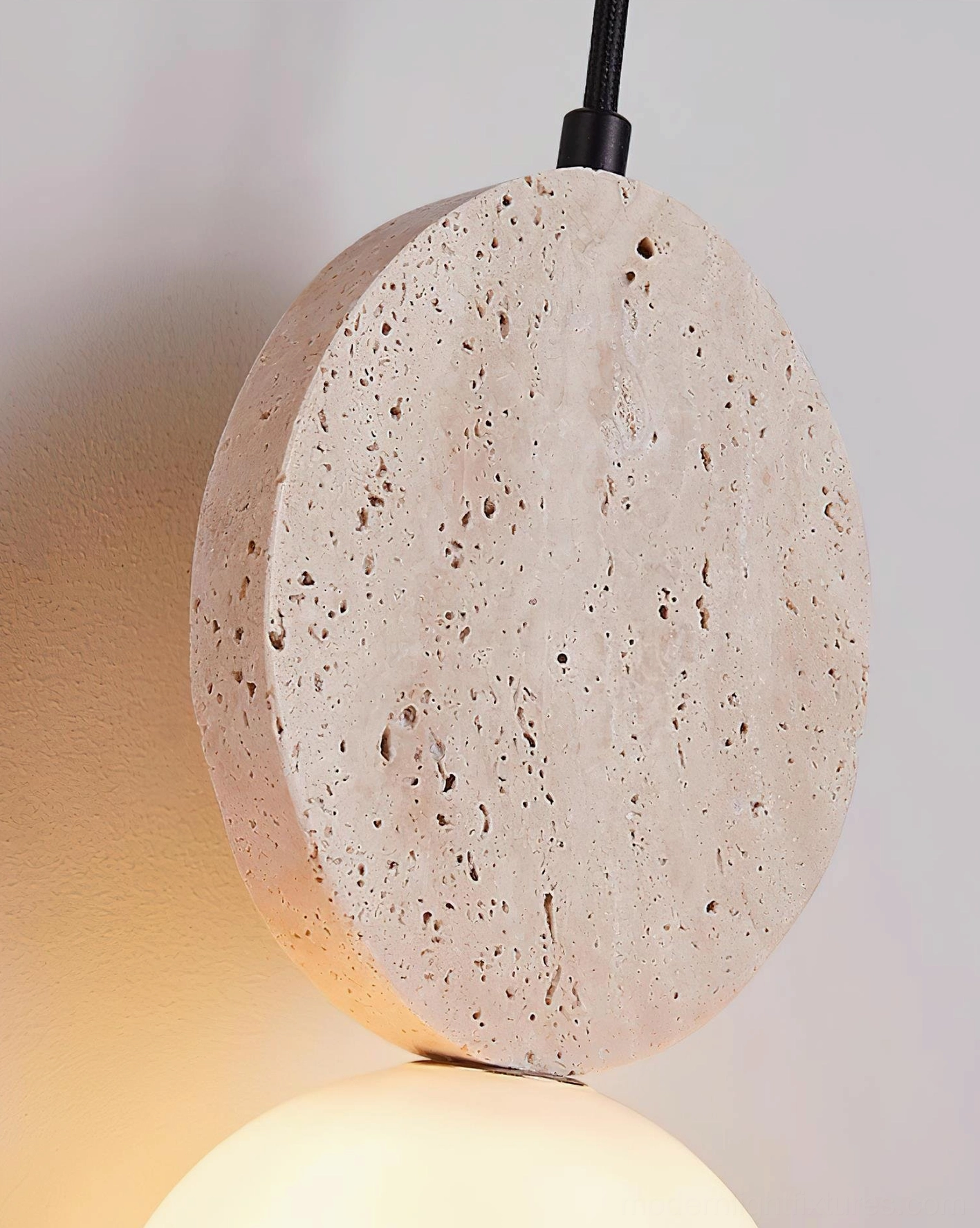 Cenari travertine and glass pendant lamp showing hand-shaped stone forms in minimalist Scandinavian design aesthetic