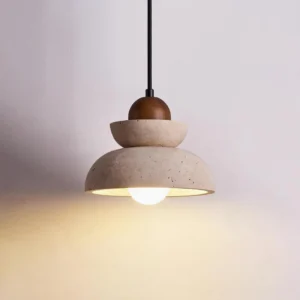 Single travertine pendant lamp with warm illumination showing exposed LED bulb and natural stone texture